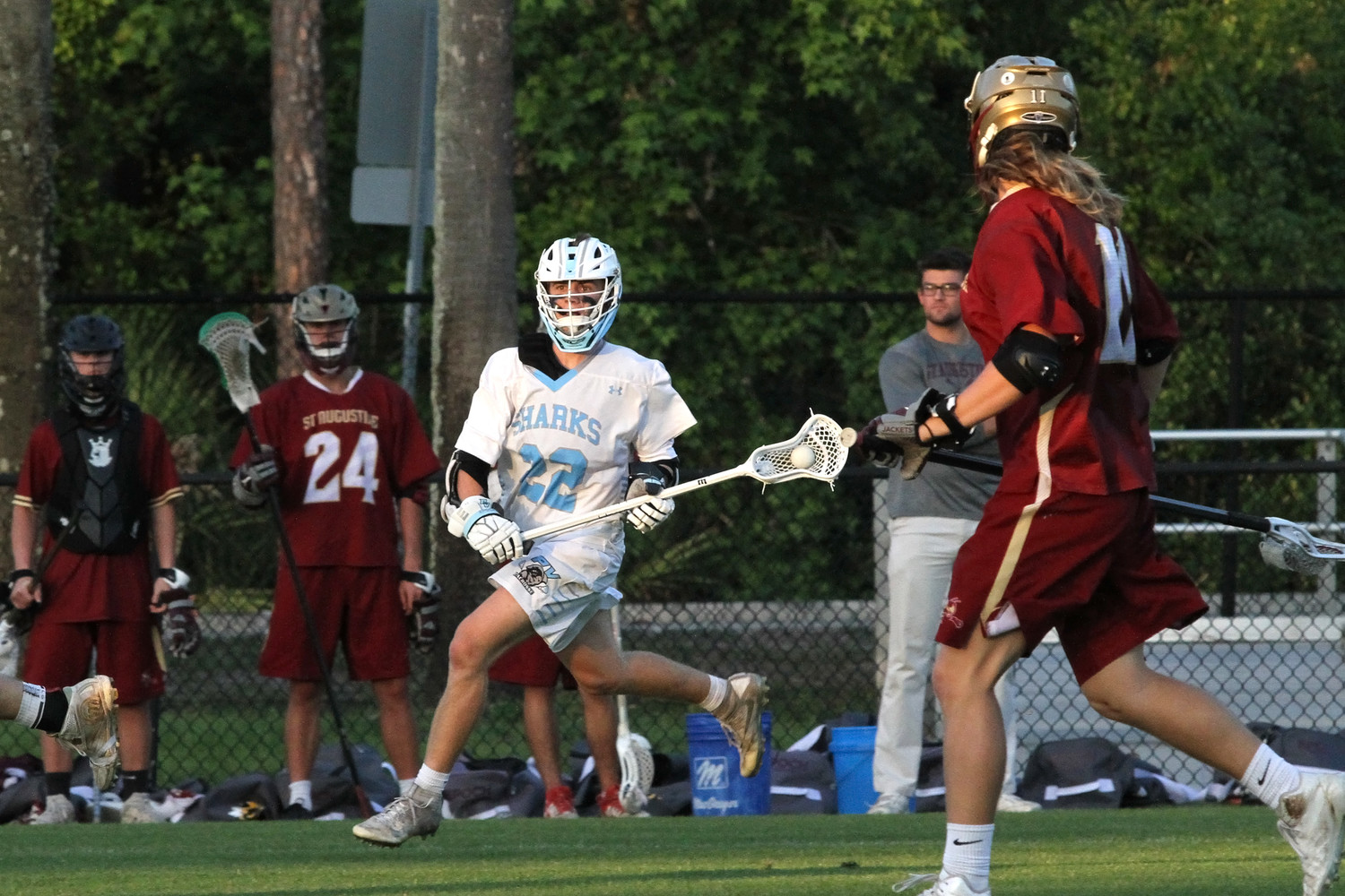 Carter Parlette looks for an open Sharks teammate against St. Augustine.